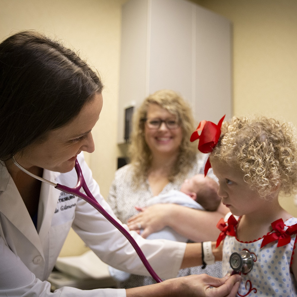 http://Pediatrician%20with%20patient